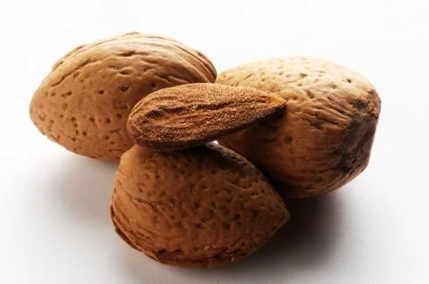 Group of almonds on the white background Stock Photos