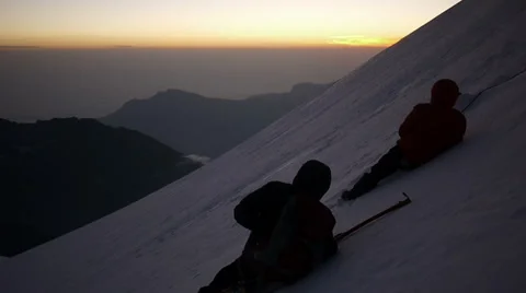 Group of Alpine Climbers lying on the snow covered mountain Stock-Footage 43248938