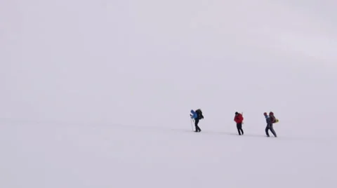 Group of Alpine Climbers surrounded only by snow Stock Footage 43248927