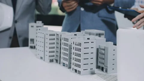 Group of alternative energy engineers discussing a project with a worker du.. Stock Footage 334138201