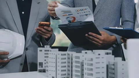 Group of alternative energy engineers discussing a project with a worker du.. Stock Footage 334138202