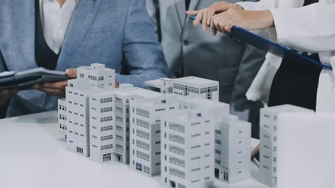 Group of alternative energy engineers discussing a project with a worker du.. Stock Footage 334138203