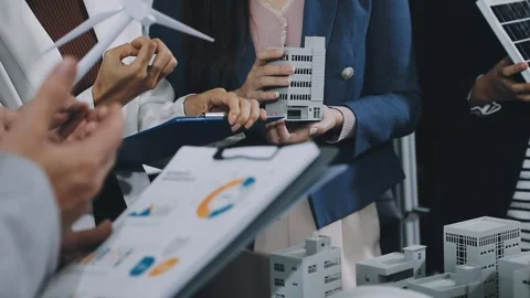 Group of alternative energy engineers discussing a project with a worker du.. Stock Footage 334138207