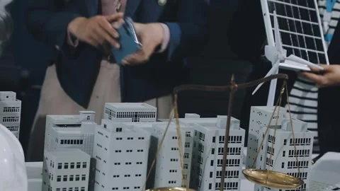 Group of alternative energy engineers discussing a project with a worker du.. Stock Footage 334138214