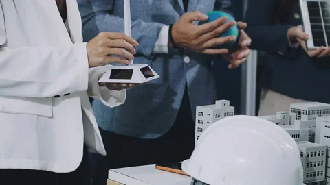 Group of alternative energy engineers discussing a project with a worker du.. Stock Footage 334138258