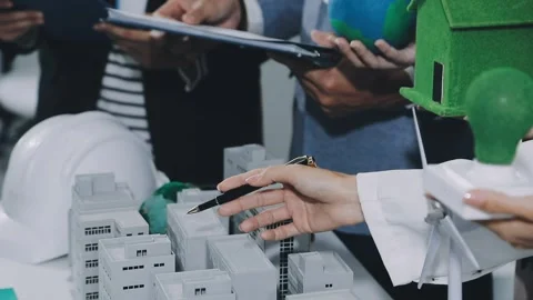Group of alternative energy engineers discussing a project with a worker du.. Stock Footage 334138273
