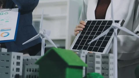 Group of alternative energy engineers discussing a project with a worker du.. Stock Footage 334138297