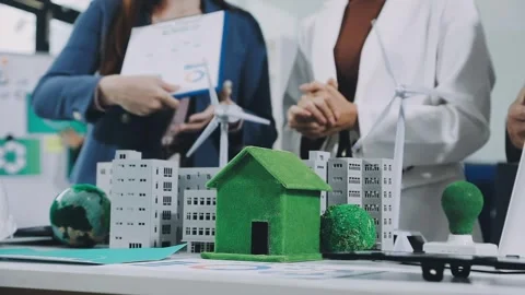Group of alternative energy engineers discussing a project with a worker du.. Stock Footage 334138302