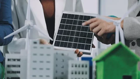 Group of alternative energy engineers discussing a project with a worker du.. Stock Footage 334138306