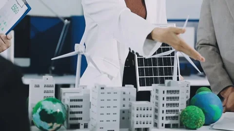 Group of alternative energy engineers discussing a project with a worker du.. Stock Footage 334138322