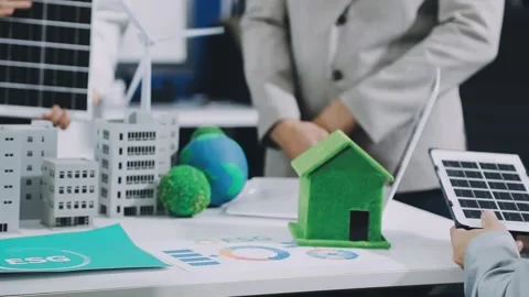 Group of alternative energy engineers discussing a project with a worker du.. Stock Footage 334138325