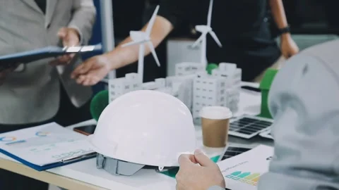 Group of alternative energy engineers discussing a project with a worker du.. Stock Footage 334138349