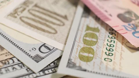 Group of American Banknotes of 100 Dollars and Georgian Lari on Rotating Table. Stock Footage 139087609