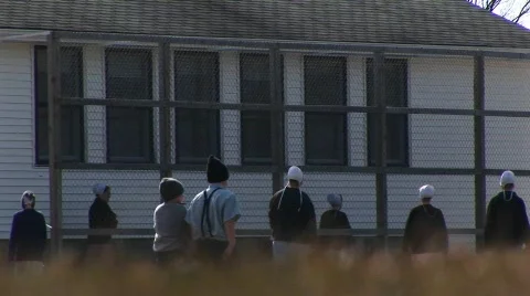 A group of Amish children play together before school Stock Footage