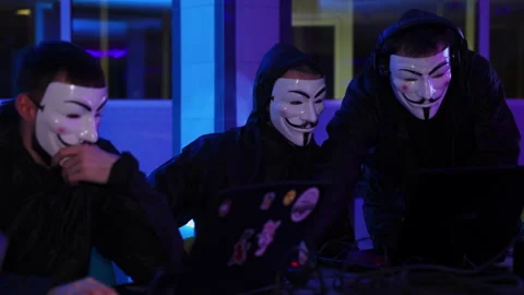 A group of Anonymous Hackers working together in a very Dark Environment to Stock Footage 297487275