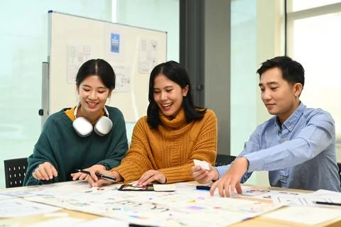 Group of application developers working on new website wireframe, planning Stock Photos