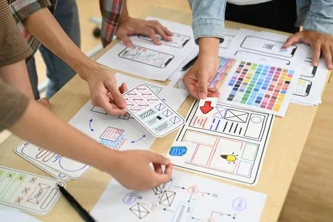 Group of application developers working on new website wireframe, planning Stock Photos