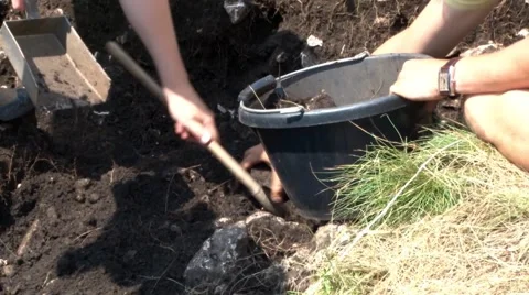 Group of archaeologists removed the earth from a historic site to empty it in Stock Footage 63390301