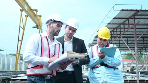 Group of architects, construction foremen, and construction engineers Stock Footage 255352360