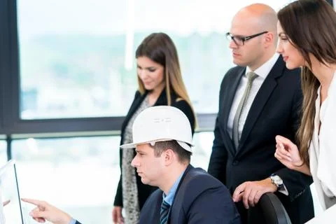 Group Of Architects Having Meeting. Solving problems and making strategy on c Stock Photos