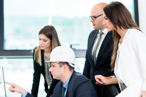 Group Of Architects Having Meeting. Solving problems and making strategy on c Stock Photos