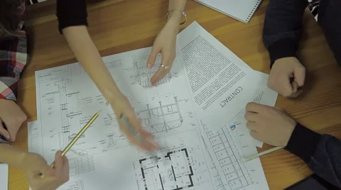 Group of Architects Planning on a New Project with their Blueprint Vídeos de archivo 57451959
