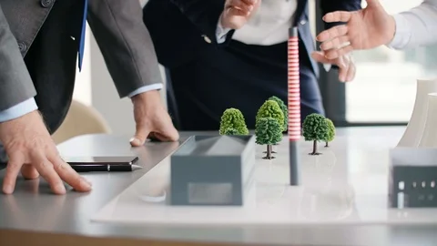 Group of architects review plans for construction Stock Footage 111315982