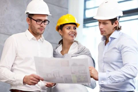 Group of architects sharing their ideas Stock Photos