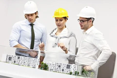 Group of architects sharing their ideas Stockfoto's