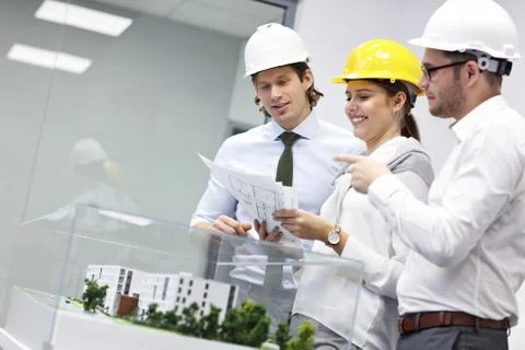 Group of architects sharing their ideas Stock Photos