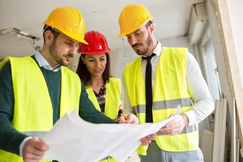 Group of architects working on a project Stock Photos