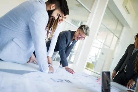 Group of architects working on project Фото