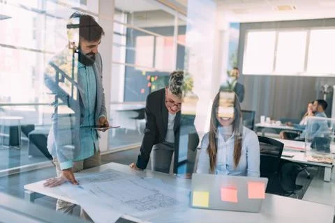 Group of architects working on project Фото