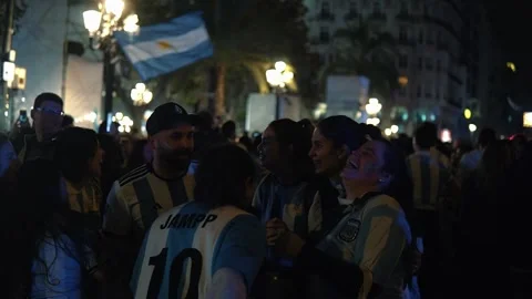 Group of Argentines with Flags Jumping in a Circle in the Middle of the Stre Stock Footage 227003749