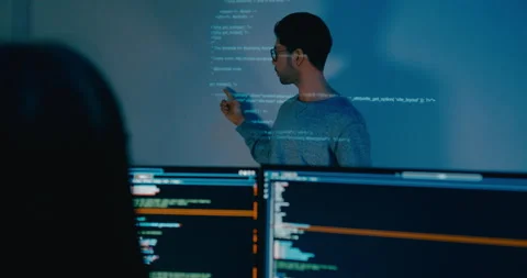 Group Asia male software developer mentor leader manager talk strat prompt AI. Stock Footage 312200293