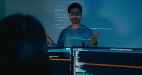 Group Asia male software developer mentor leader manager talk strat prompt AI. Stock Footage 312201133