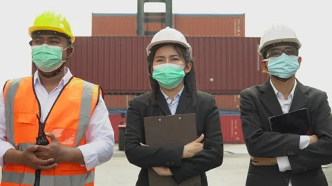 Group of asian container cargo warehouse worker wearing and checking protecti Stock Footage 154689845
