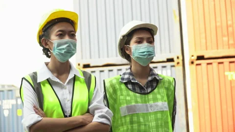 Group of asian container cargo warehouse worker wearing protective face mask Stock Footage 156382080
