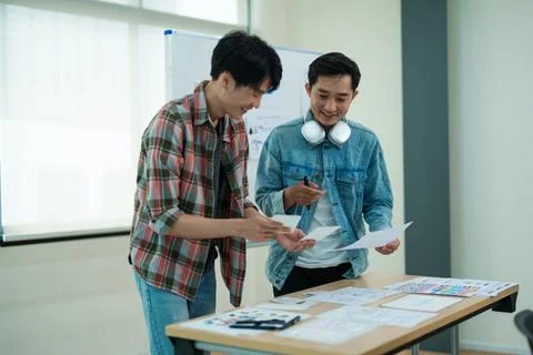 Group of asian creative team programing designers participate in all phases of Stock Photos