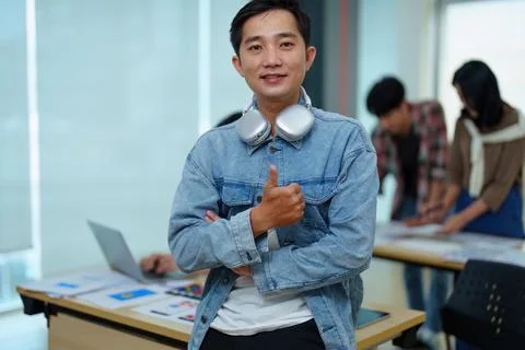 Group of asian creative team programing designers participate in all phases of Stock Photos