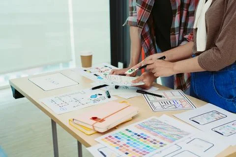 Group of asian creative team programing designers participate in all phases of Stock Photos