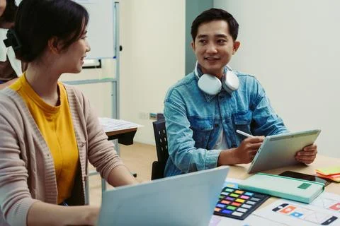 Group of asian creative team programing designers participate in all phases of Stock Photos