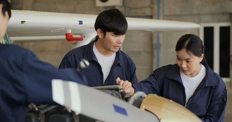 Group asian engineer having a discussion about airplane project. Stock Footage 124725086