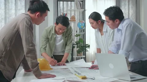 Group Of Asian Engineers Drawing Building Construction At The Office Video stock 172416018