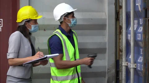 Group of asian harbor worker Wearing Medical Face Mask open  Containers box s Stock Footage 156381997