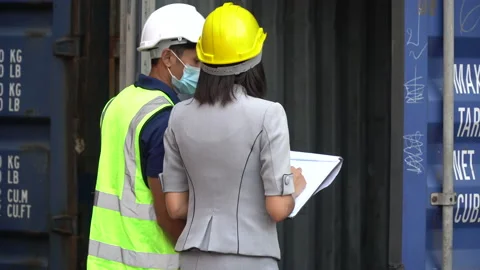 Group of asian harbor worker Wearing Medical Face Mask  checking product qual Stock Footage 159391828