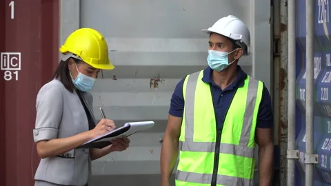 Group of asian harbor worker Wearing Medical Face Mask open  Containers box s Stock Footage 159392967