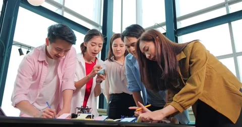 Group of Asian high school students building and programming electric toys Stock Footage 211416342
