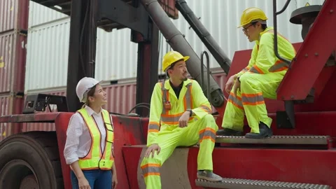 Group of asian industrial engineer talking togather in cargo container warehouse Stock Footage 261938684