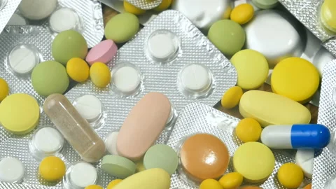 Group of assorted capsules, pills, tablets and blisters, background, rotation Stock Footage 157203864